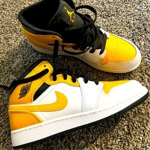 Jordan 1 mid black and yellow.